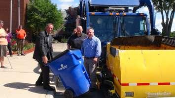 Mayor Randy Hope and Progressive Waste Solutions reps show off their new automated wast collection system (Photo by Jake Kislinsky)