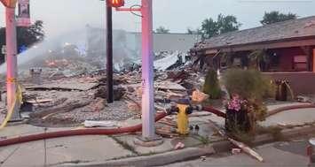 An explosion in downtown Wheatley on August 26, 2021 brings a building down to rubble  (Screengrab via Chatham-Kent Fire Twitter)