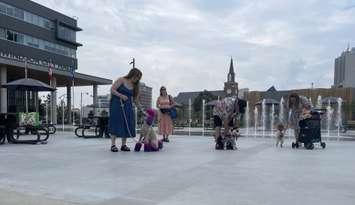 Dogs and their owners set to participate in the Dog Days of Summer event in downtown Windsor, July 16, 2025. (Photo by Maureen Revait) 