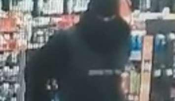 A suspect in a pair of robberies at Tecumseh businesses is shown in a surveillance image, May 5, 2025. Image provided by Ontario Provincial Police.