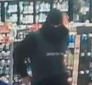 A suspect in a pair of robberies at Tecumseh businesses is shown in a surveillance image, May 5, 2025. Image provided by Ontario Provincial Police.