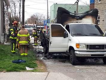 Windsor firefighters inspect a burned-out work truck on Tuscarora near Parent on April 18, 2019. Photo by Mark Brown/Blackburn News.