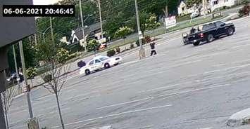 Footage showing Nathaniel Veltman voluntarily getting down on his knees moments before several London Police Service cruisers arrived to the parking lot of Cherryhill Village Mall. Capture via exhibit video from Ontario Superior Court of Justice. 