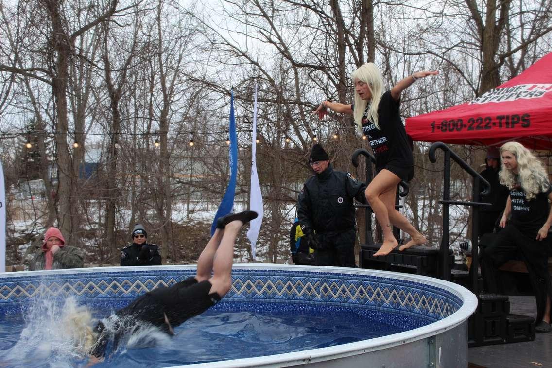 CK Mornings on 94.3 CKSY radio hosts Chris McLeod, Allanah Wills, and Matt Weverink (left to right) jump into the pool at the Polar Plunge for Special Olympics at Sons of Kent Brewing Company in Chatham. (Photo by Jessica Herder)