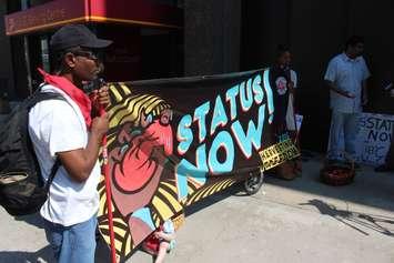 Migrant workers rallying in downtown Windsor for the government to change their status, September 6, 2016. (Photo by Mike Vlasveld)