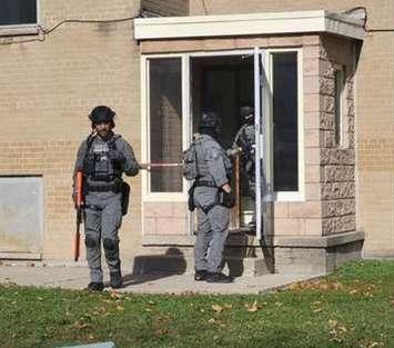 Sarnia police executing a search warrant at an apartment on Walnut Avenue (Photo by :Sarnia police)