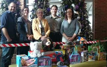 Ryan Crits (left) host of Country 95.9/92.7, Leslie Boyle, Clinical Practice Manager of Pediactrics, Lucia St. Aubin, Manager of Pediatrics, Cordell Green, program director for Country 95.9/92.7 and Jen Burton Liang, Child Life Specialist at Met Campus.