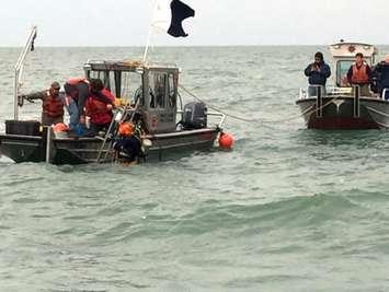 Contractors conduct dive operations at the site of a sunken barge near the Kelley's Island Shoal in Lake Erie, Oct. 21, 2015. (U.S. Coast Guard photo courtesy of Station Marblehead)