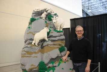 Artist Sean Kenney with his LEGO sculpture featured in the Animal Super Powers exhibit at LaSalle Landing, January 19, 2024. (Photo by Maureen Revait)