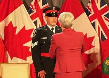 (Photo of Sergeant Matt Capel-Cure receiving an Ontario Medal for Police Bravery courtesy of the Windsor Police Service)