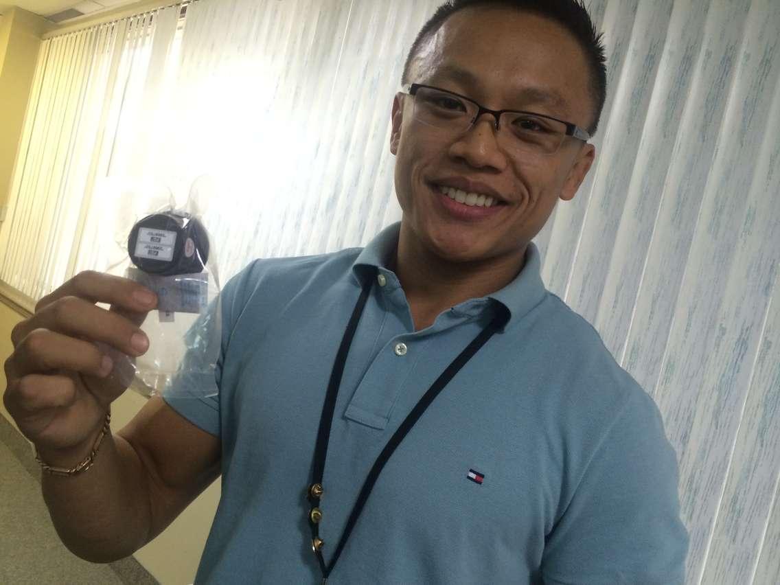 Phil Wong, public health inspector with the Windsor-Essex County Health Unit, holds a radon test kit at the launch of a radon awareness campaign on November 6, 2015. (Photo by Ricardo Veneza)