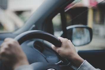 Driver holding steering wheel (Image by bee32 / iStock / Getty Images Plus via Getty Images)