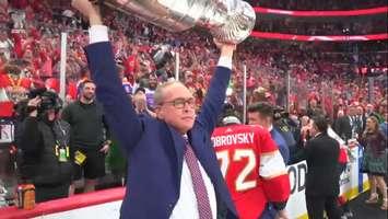 Overcome with emotion, Florida Panthers head coach Paul Maurice lifts the Stanley Cup following the Panthers' Game 7 win over the Edmonton Oilers in Sunrise, Florida, June 24, 2024. Screenshot courtesy NHL.com via ESPN.