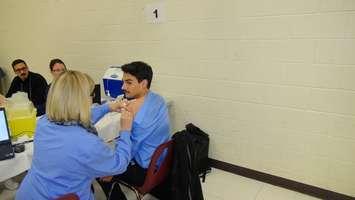 Blackburnnews.com Reporter Jake Kislinsky gets his flu shot at one of the Chatham-Kent Public Health's clinics.