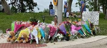 A growing memorial at the corner of Hyde Park and South Carriage roads in honour of a Muslim family who was run down, June 8, 2021. (Photo by Blair  Henatyzen, Blackburn Media)