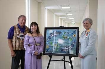 Chief Dan Miskokomon, Walpole Island First Nation and CKHA Board Member; Mariah Alexander, Artist; Lori Marshall, President and CEO, CKHA. (Photo courtesy of the Chatham-Kent Health Alliance)