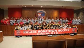 The LaSalle Vipers, in grey sweaters, join Lasalle Town Council, town administration and youth hockey players in unveiling LaSalle as a Hometown Hockey host, September 10, 2019. Photo by Mark Brown/Blackburn News.