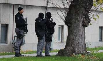 Windsor police investigate a man barricaded inside of an apartment on the corner of Lincoln Rd. and Richmond St., November 12, 2014. (photo by Mike Vlasveld)