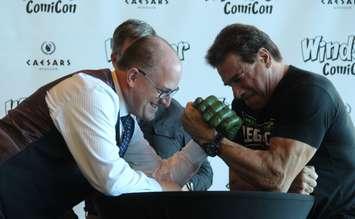 Windsor Mayor Drew Dilkens arm wrestles actor Lou Ferrigno to open Windsor ComiCon, October 14, 2016. (Photo by Maureen Revait)