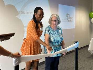 Princia Gateka and Doris Sauve celebrate the grand opening of École secondaire catholique Sainte-Trinité, May 4, 2022. (Photo by Maureen Revait)