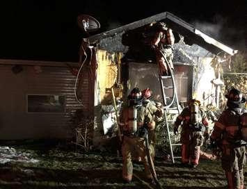 Firefighters in Essex work to overhaul a mobile home after it caught fire. March 2, 2021. (Photo courtesy of @EssexON_Fire on Twitter.) 