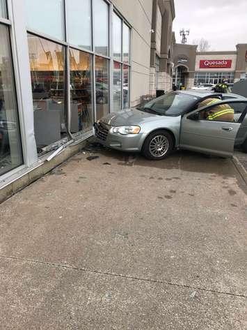 A vehicle is seen against a damaged window at a Shoppers Drug Mart in Tecumseh, January 16, 2020. Photo provided by Tecumseh Fire/Twitter.