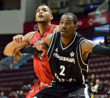 Kirk Williams Jr. of the Mississauga Power battles Kevin Loiselle of the Windsor Express. (photo courtesy of Kevin Jarrold)
