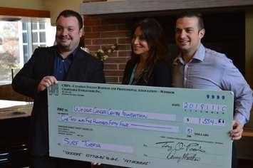 CIBPA presents a cheque to the Windsor Cancer Centre Foundation as part of its Grow Me campaign. From left, Joe Balsamo, chairperson of Surf Turfia; Houida Kassem, executive director of the WCCF; and Ferruccio De Sacco of BDO; at the Windsor Regional Cancer Centre, December 13, 2018. Photo by Mark Brown/Blackburn News.