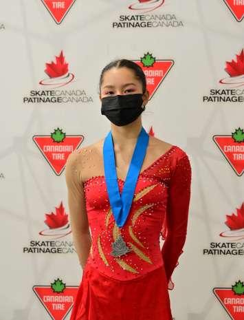 Katharine Karon poses with her silver medal at the 2022 Skate Canada Challenge in Regina, Saskatchewan, December 4, 2021. Submitted photo.