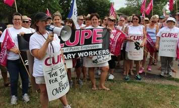 CUPE Local 2974 representing library workers in Essex County hold rally outside Tecumseh library branch, July 14, 2016. (Photo by Maureen Revait)