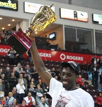 Chris Commons of the Windsor Express hoists the NBL Canada championship trophy. April 17, 2014. (Photo by Mike Vlasveld)