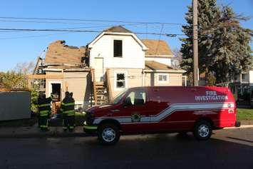 Windsor Fire And Rescue Service Investigators take a look at a duplex fore on Cataraqui St. at Pierre Ave., November 7, 2016. (Photo by Mike Vlasveld)