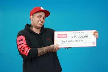 Wayne Last with his cheque from the OLG. (Photo, courtesy OLG)