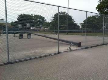 A large light pole is being repaired at the Forest Glade tennis courts. (Photo by Jason Viau)