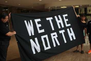 The "We the North" flag that flew over Charles Clark Square in Windsor during the NBA Finals is turned over to  St. Clair College at the SportsPlex, June 18, 2019. Photo by Mark Brown/Blackburn News.