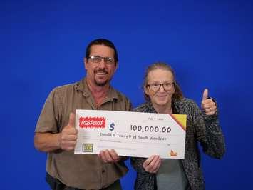 Donald and Tracey Dupuis of Lakeshore pick up their $100,000 cheque at the OLG Prize Centre in Toronto, July 7, 2020. Photo provided by OLG.