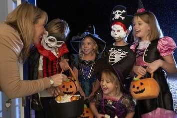 Kids trick-or-treating on Halloween. File photo courtesy of © Can Stock Photo / monkeybusiness