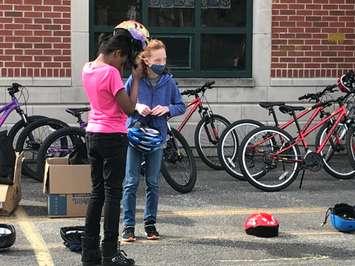 Students at King Edward Public School take part in bike safety training on May 10, 2022. (Photo by Adelle Loiselle)
