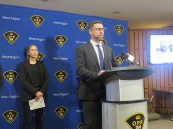 Detective Constable John Armit from the OPP Serious Fraud and Anti-Rackets Branch speaks at the OPP West Region Headquarters in London. Photo by Rebecca Chouinard.