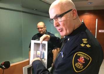 Windsor Police Chief Al Frederick hold up a picture of the drug lock-up at its headquarters, March 31, 2017. (Photo by Mike Vlasveld)