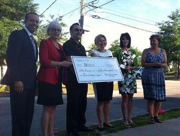 The Windsor-St. Clair Rotary Club presents a cheque to Hotel-Dieu Grace Healthcare for a new greenhouse. (Photo by Jason Viau)