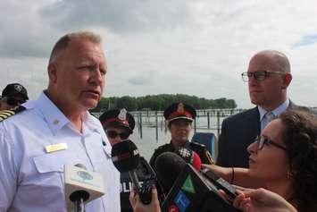 Windsor Port Authority Harbourmaster Peter Berry speaks to reporters as Windsor Acting Police Chief Pam Mizuno and Mayor Drew Dilkens listen at Lakeview Park Marina on July 12, 2019. Photo by Mark Brown/Blackburn News.