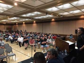 Unifor Local 444 president Dino Chiodo (standing, far right) speaks to members at the Caboto Club in Windsor on July 30, 2017 (Photo courtesy Unifor Local 444/Facebook)
