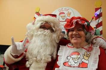Scott Powers (left), also known as Deaf Santa, and his mother Mary Powers (right) hold a Deaf Santa event at Cheese Wheelz pizzeria downtown Windsor on November 17, 2016. (Photo by Ricardo Veneza)