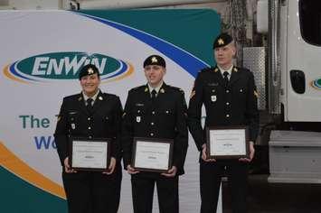 EnWin presents scholarships to Corporal Rebecca Momney, left, Corporal Brandon Badour and Corporal William Tate as part of its Powerful Partnership program in Windsor, December 6, 2018. Photo by Mark Brown/Blackburn News.