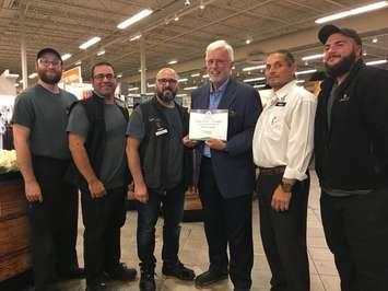 Chatham-Kent-Leamington MPP Rick Nicholls, in blue sports coat, presents the Foodland Ontario Platinum Award to staff at Zehrs in LaSalle on September 4, 2019. Photo by Paul Pedro, Blackburn News.