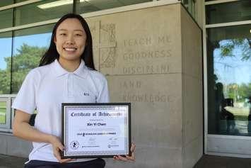 Kini Chen with her award announcing a Schulich
Leadership scholarship, May 31, 2023. Photo courtesy Windsor-Essex Catholic District School Board.