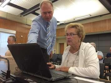A residents gets some help during a demonstration of the new online voting system Leamington will be using for the 2014 municipal elections. Photo taken August 27, 2014. (Photo by Ricardo Veneza)