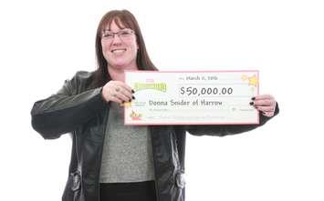 Donna Snider poses with her winning cheque from the Ontario Lottery and Gaming Corporation. (Photo provided by the OLG)