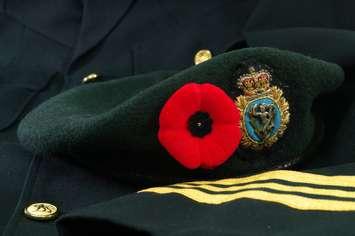 A Remembrance Day poppy on a Veteran's beret.  © Can Stock Photo / EdCorey